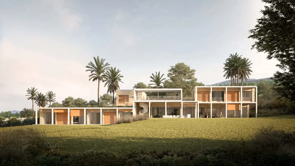 Villa de volúmenes horizontales blancos sobre una pradera, entre palmeras y vegetación