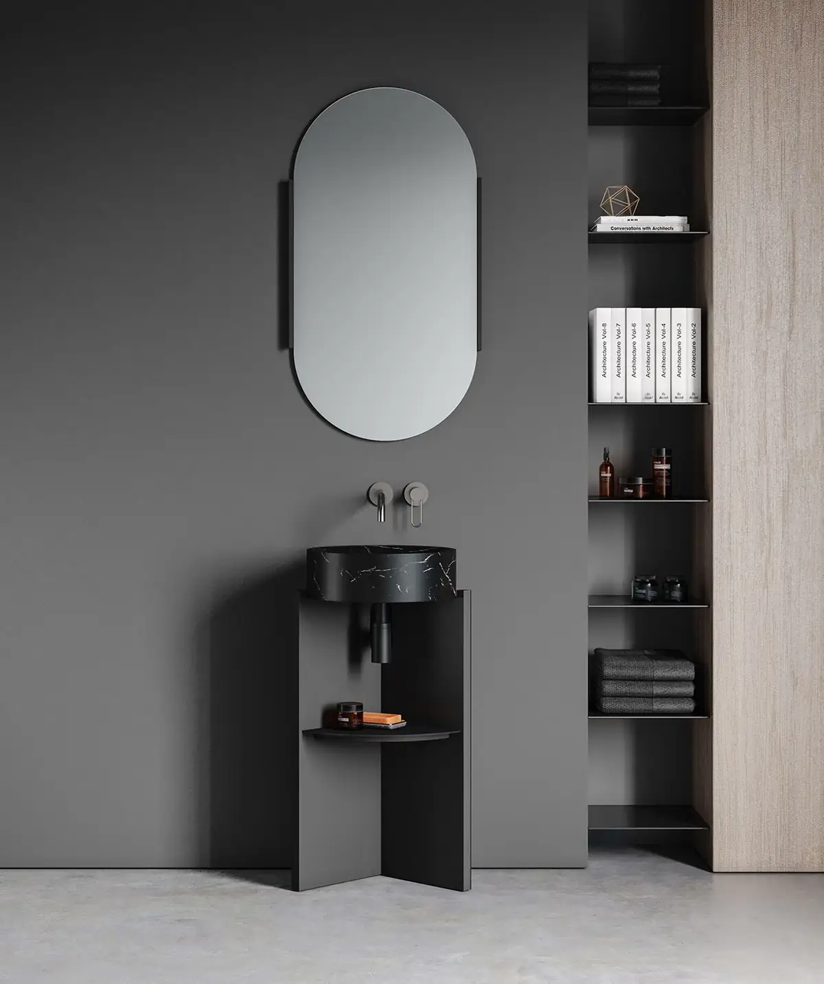 Lavabo de pie negro con lavabo circular de mármol negro veteado, bandeja auxiliar y espejo ovalado, junto a una estantería metálica.